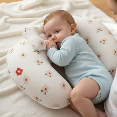 bébé couché coussin allaitement fleurs